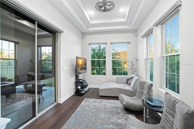 sunroom with a raised ceiling and a wealth of natural light