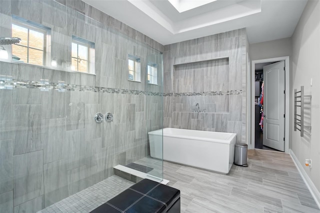 bathroom with separate shower and tub