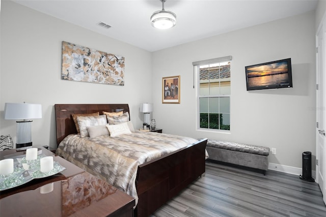 bedroom with hardwood / wood-style floors