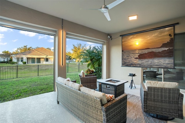 interior space featuring ceiling fan and an outdoor living space