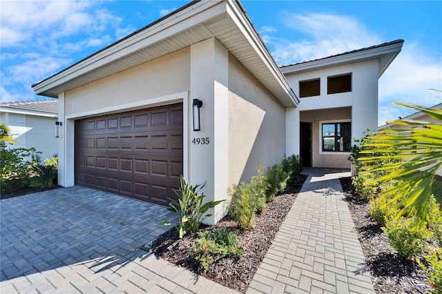 entrance to property featuring a garage