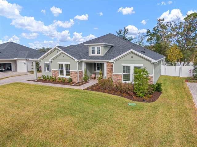 view of front of house featuring a garage and a front lawn