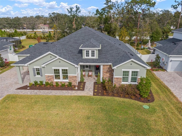 craftsman-style home with a front yard