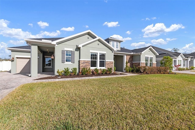 view of front of property featuring a garage and a front yard