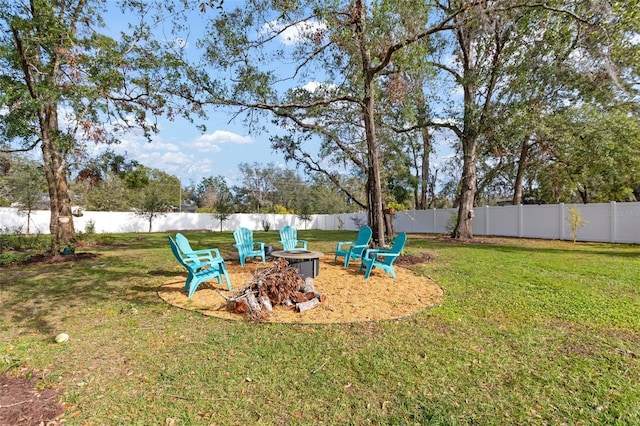 view of yard with an outdoor fire pit