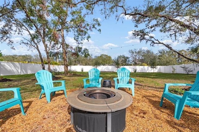 view of yard with an outdoor fire pit