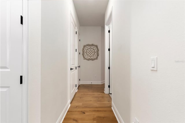 corridor featuring light wood-type flooring