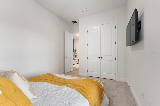 carpeted bedroom featuring a closet