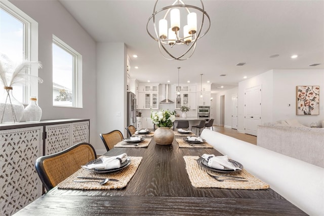 dining space featuring an inviting chandelier