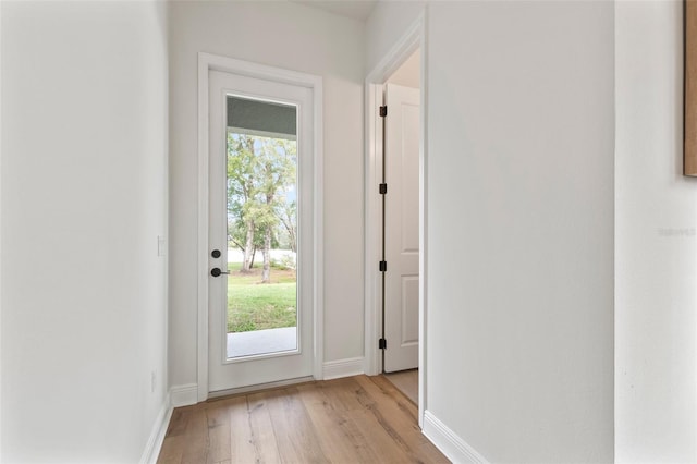 doorway to outside with light hardwood / wood-style floors