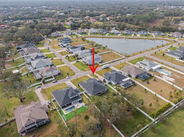 birds eye view of property featuring a water view