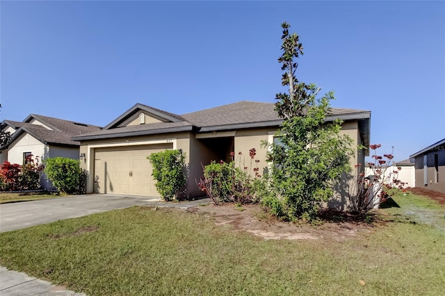 view of front of property with a garage and a front yard