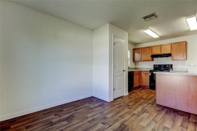 kitchen with dark wood-type flooring, black appliances, and sink