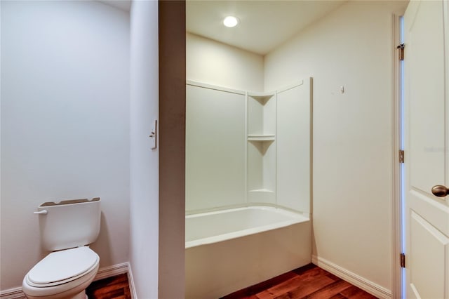 bathroom with toilet and hardwood / wood-style flooring