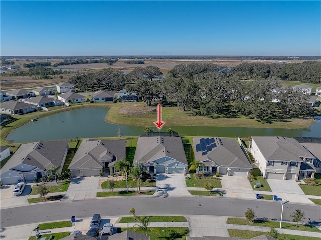 drone / aerial view with a water view