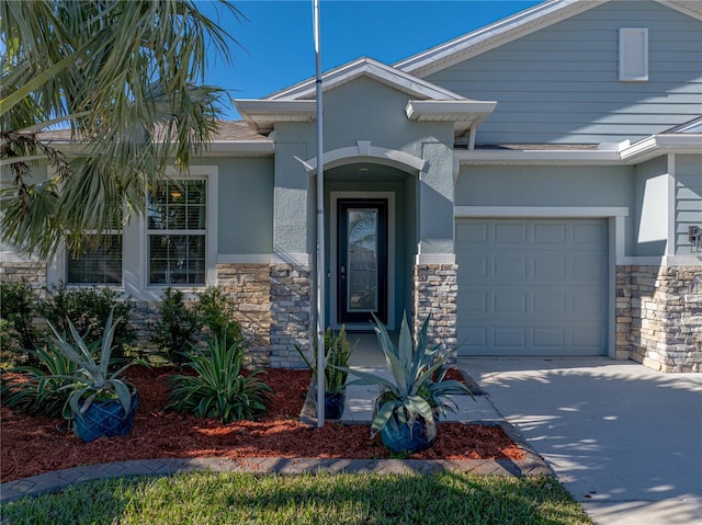 view of exterior entry featuring a garage