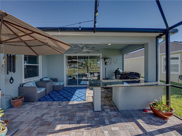 view of patio with ceiling fan and an outdoor hangout area