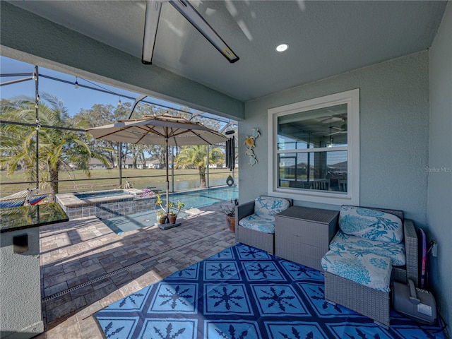 view of patio featuring a lanai and a swimming pool with hot tub