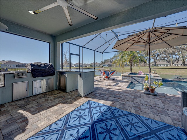 view of patio with a lanai, an outdoor bar, grilling area, area for grilling, and an in ground hot tub