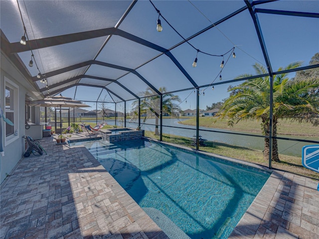 view of pool with a lanai, a patio area, an in ground hot tub, and a water view