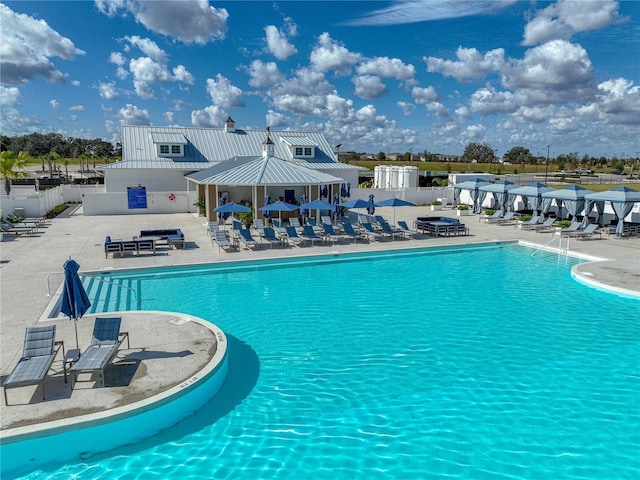 view of swimming pool featuring a patio area