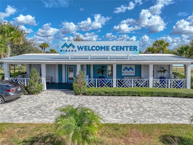 view of front facade with a carport