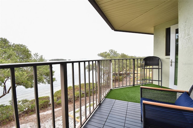 balcony featuring a water view