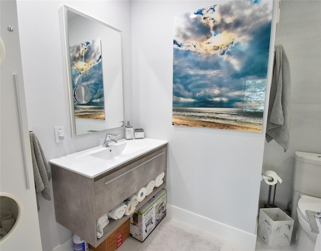 bathroom with vanity and toilet