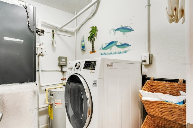 washroom with electric water heater and washer / dryer