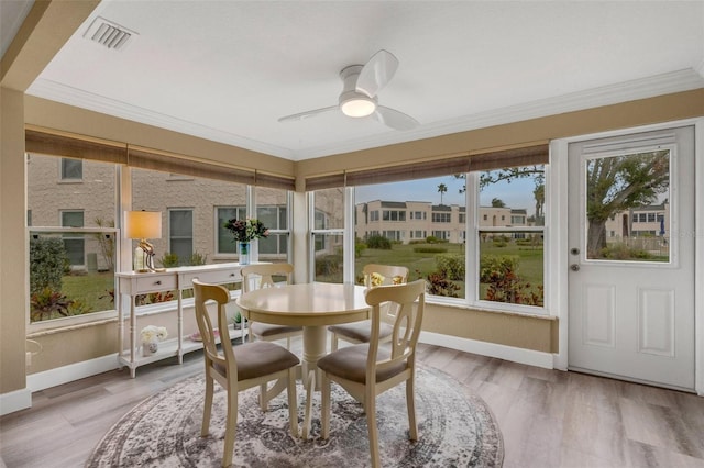 sunroom / solarium with ceiling fan and plenty of natural light