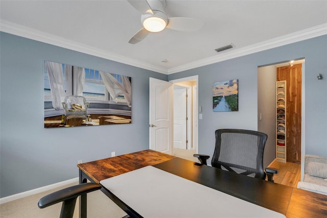 office space featuring ceiling fan and ornamental molding