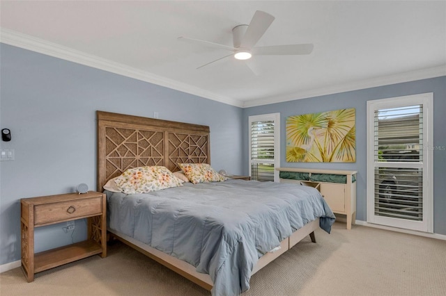 carpeted bedroom featuring ceiling fan and ornamental molding