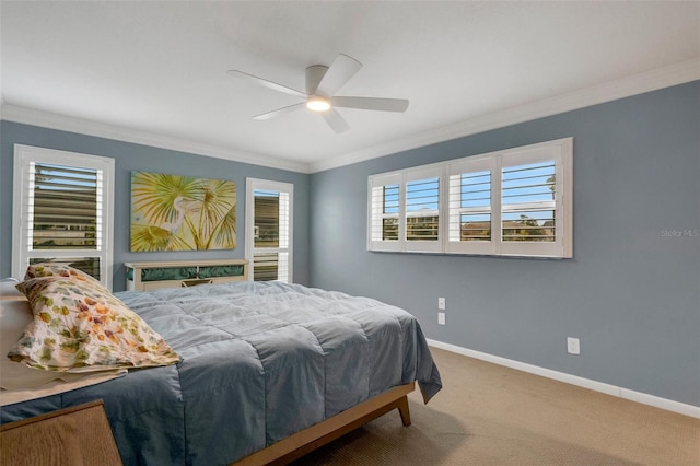 bedroom featuring ceiling fan, carpet floors, and crown molding