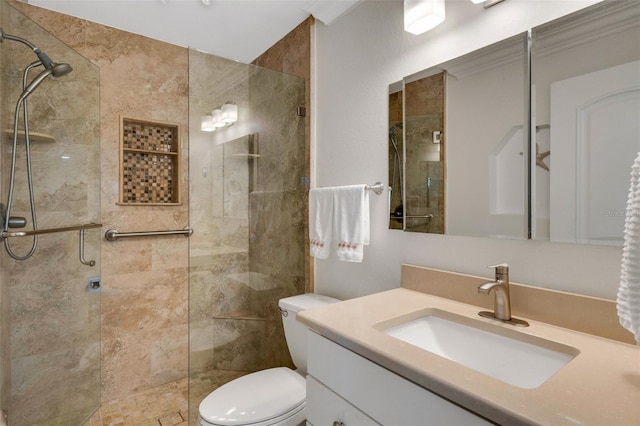 bathroom featuring toilet, an enclosed shower, crown molding, and vanity