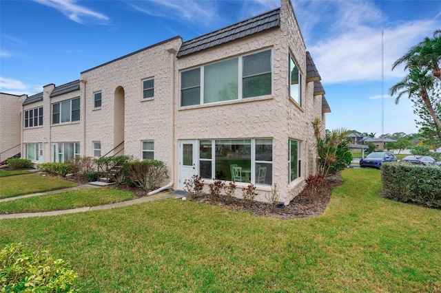 exterior space featuring a front lawn