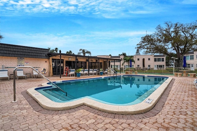 view of swimming pool with a patio