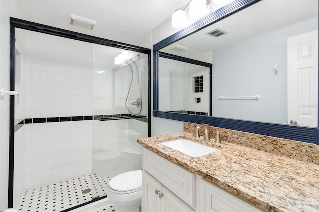 bathroom with walk in shower, vanity, and toilet