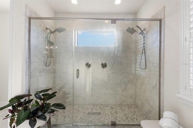 bathroom with a shower stall and toilet