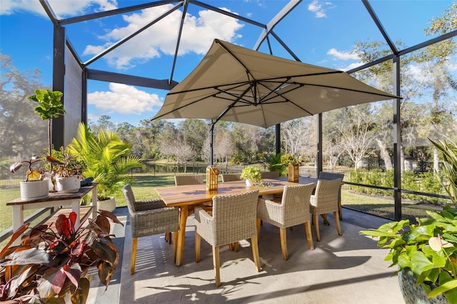 view of patio / terrace with a lanai and outdoor dining area