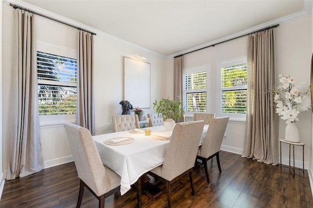 dining area with dark wood-style floors, baseboards, and ornamental molding