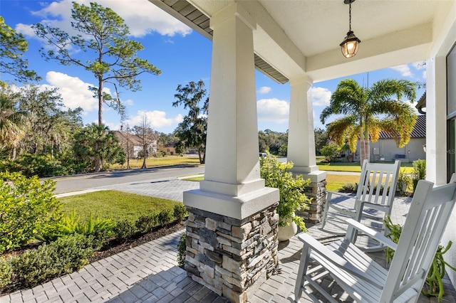 view of patio featuring a porch