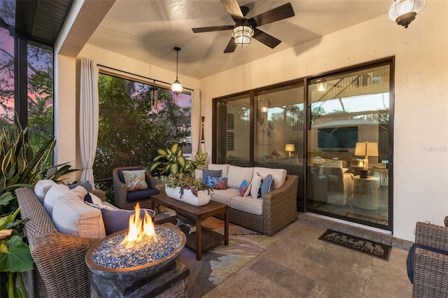 sunroom / solarium with a ceiling fan