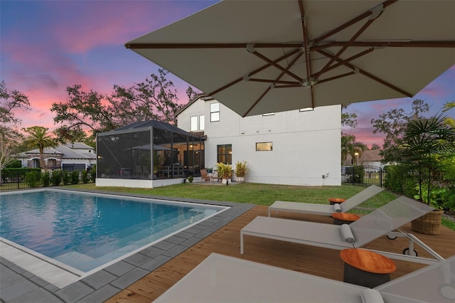 view of swimming pool featuring a fenced in pool, a gate, fence, and a lawn