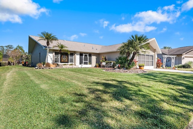 ranch-style home with a front yard and a garage