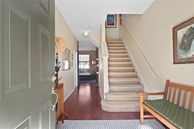 foyer entrance featuring dark hardwood / wood-style floors