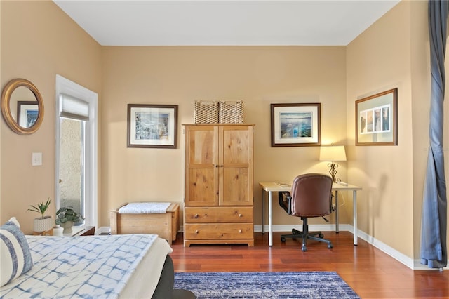 bedroom featuring dark wood-type flooring