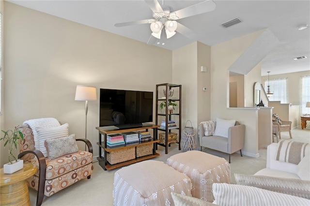 living room featuring ceiling fan and light colored carpet