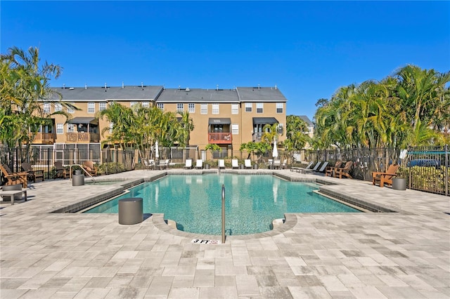 view of swimming pool featuring a patio area