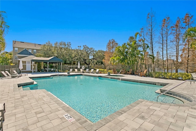 view of swimming pool featuring a patio area and a gazebo