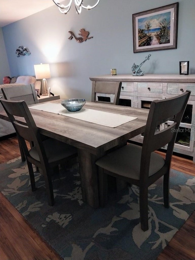 dining room with dark hardwood / wood-style floors